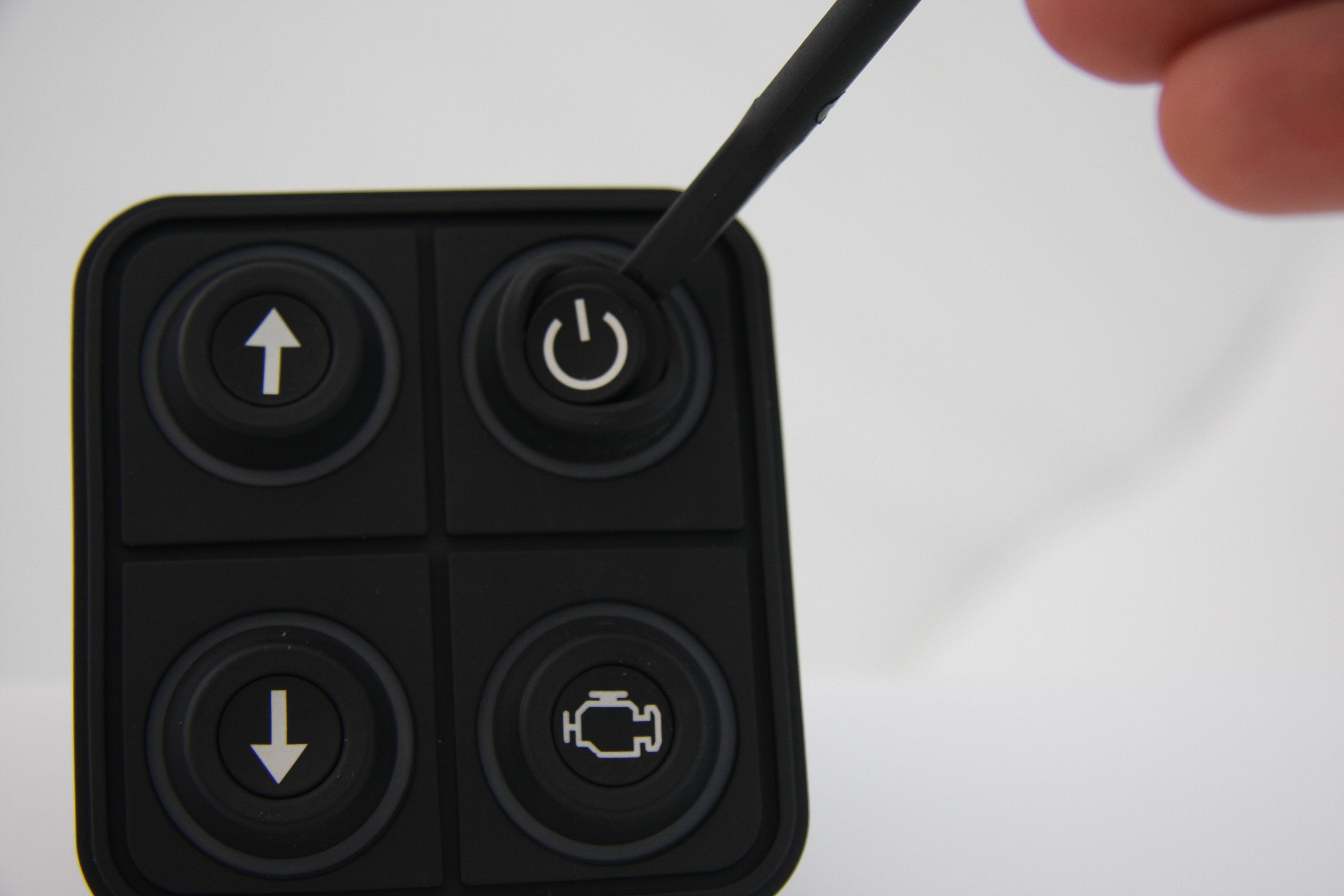 Hand pressing PKI button